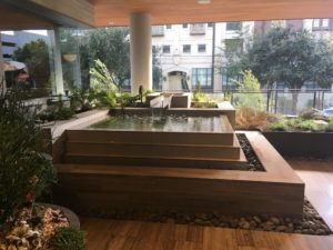 Tranquil fountain at entrance to Fifth & West